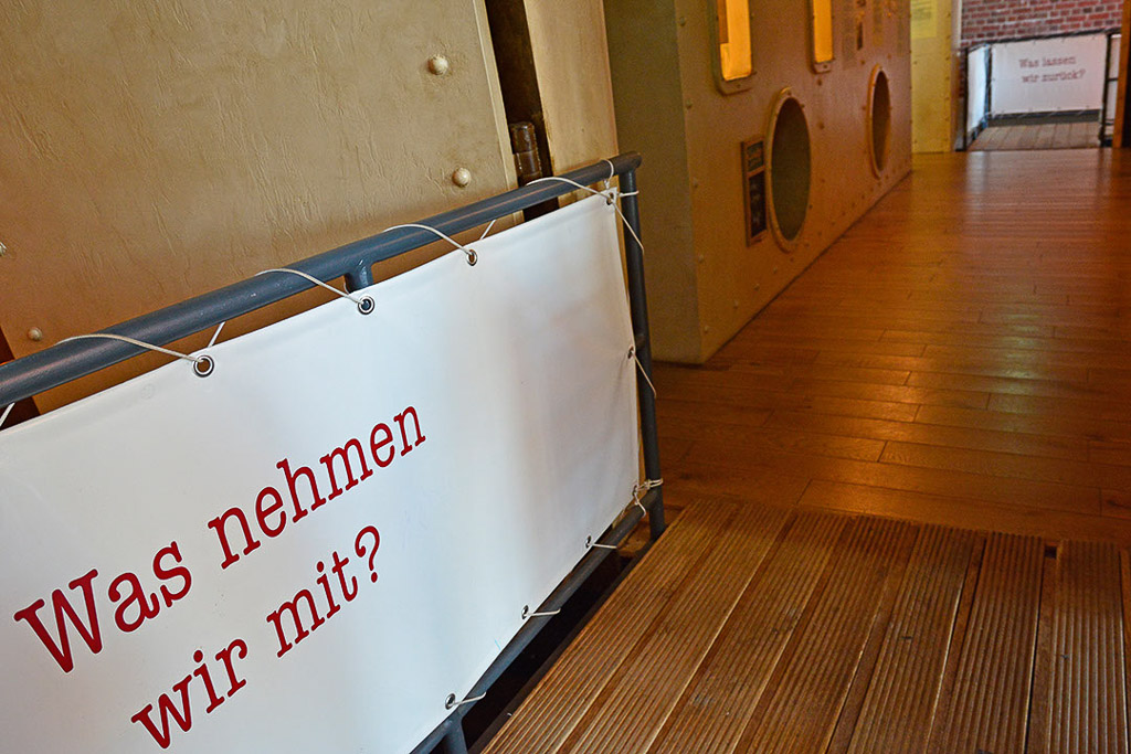 Raum mit der Frage „Was nehmen wir mit?“